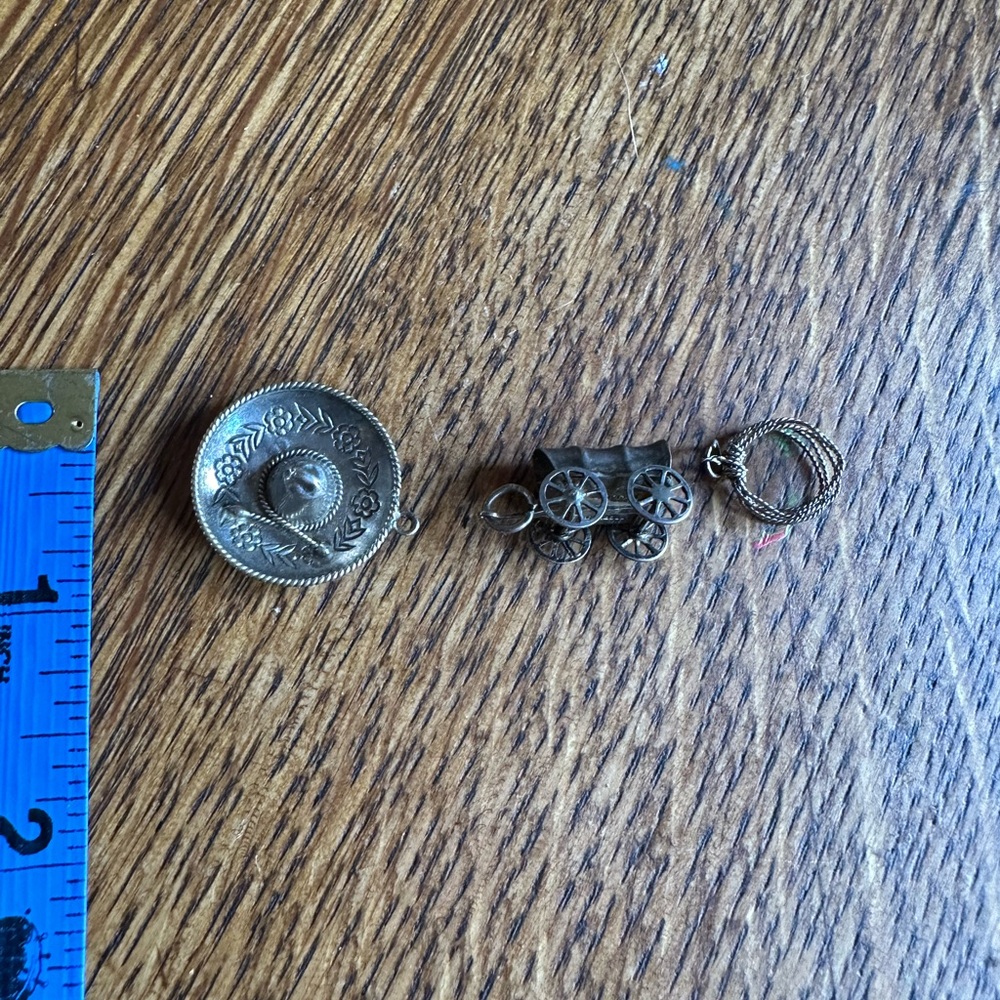 Three vintage Sterling silver western themed charms, send offers